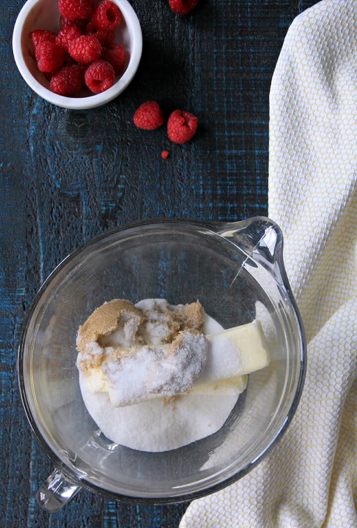 A bowl of sugar and butter to make shortbread crust for raspberry bars.