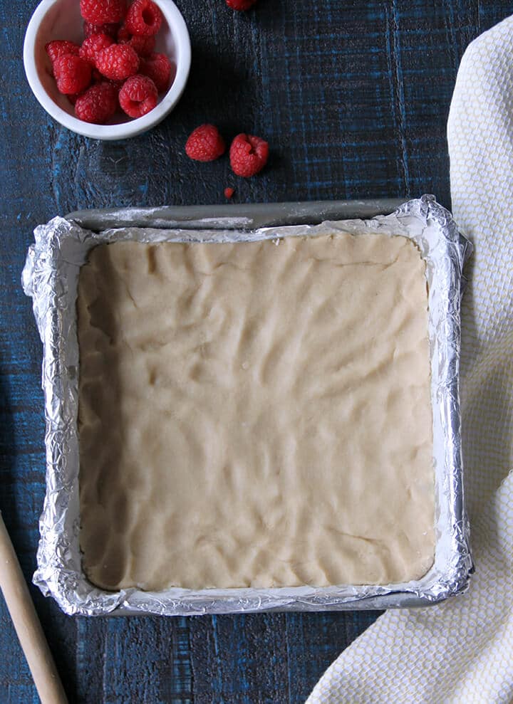 Pan of unbaked shortbread for making raspberry shortbread bars.