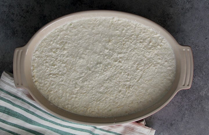 A dish of Vidalia onion dip ready to bake.