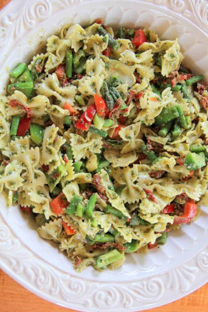 A bowl of lemon basil pesto pasta salad ready to serve.