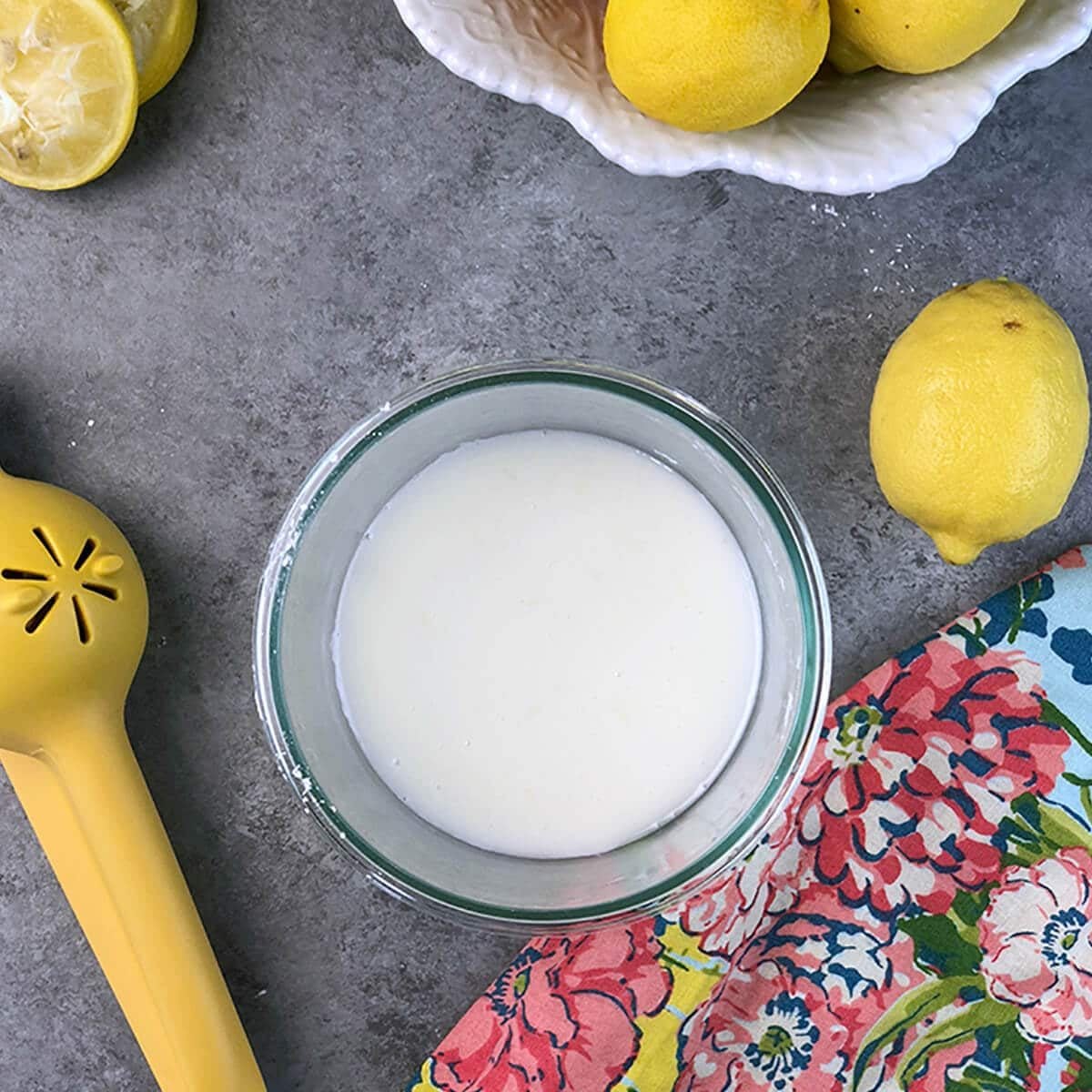 Lemon glaze icing that's easy and is the perfect glaze for cakes or cookies! Just powdered sugar and lemon juice with a few secret touches.