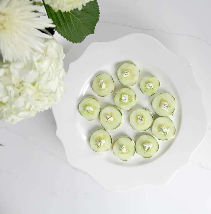 Overhead photo of a plate of cucumber tea sandwiches.