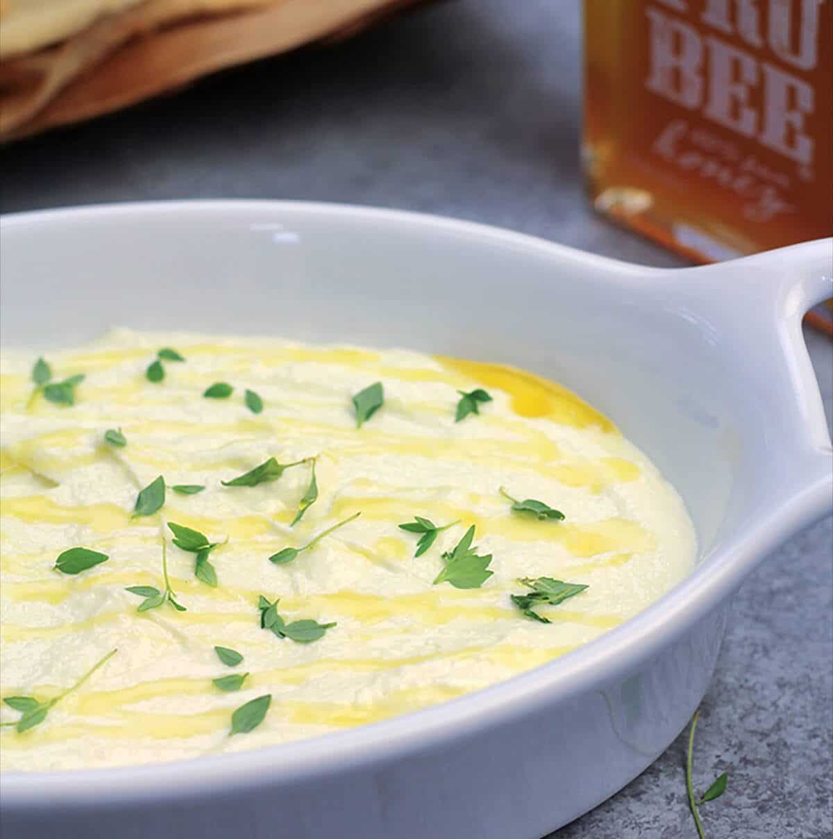 Easy Feta Dip that you can make in less than 10 minutes! Bring the flavor of the Greek islands to your next party with this simple smooth and creamy dip!
