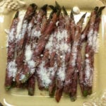 Prosciutto wrapped asparagus crispy from the grill and sprinkled with Parmesan cheese--this is one of our favorite and easiest appetizers! The plate is empty almost before it hits the table.