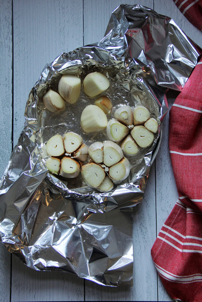 Garlic cloves in foil for roasting in the oven. 