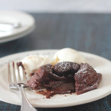 Chocolate Molten Lava Cake with bittersweet chocolate and cocoa has a luscious, gooey, chocolate center and can be made ahead! Perfect date night dessert!