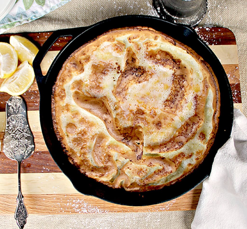 Overhead photo of a Dutch baby german pancake in a cast iron skillet.