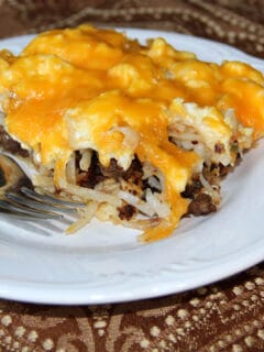 Sausage breakfast pizza with eggs and cheese over a crescent roll crust is a fun and delicious cheesy breakfast. Kids love this recipe!