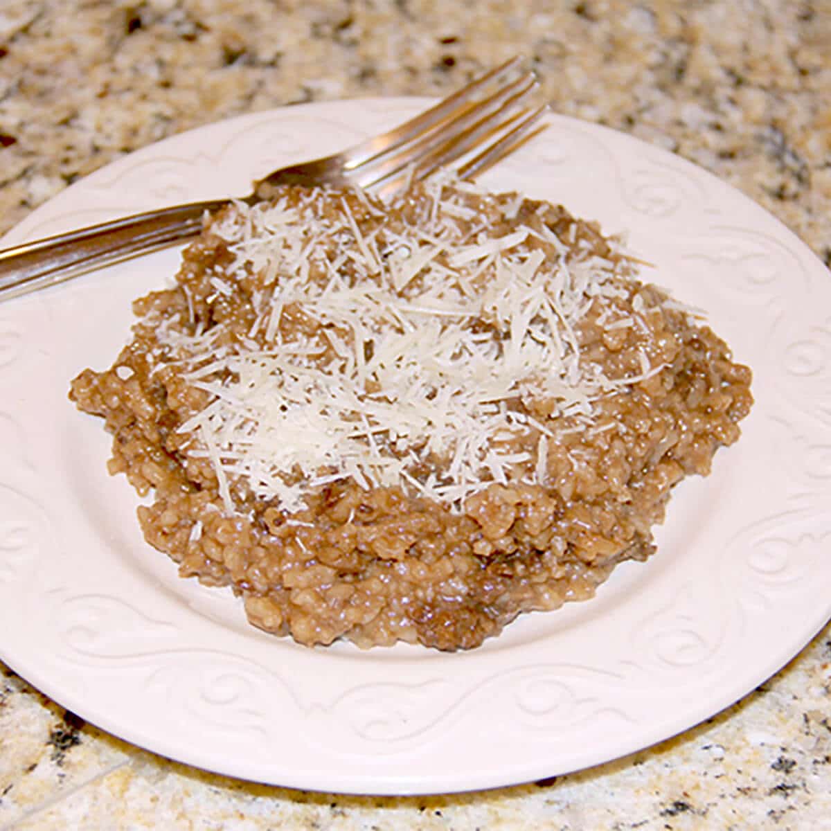 A creamy, traditional Italian sausage and mushroom risotto with red wine. The perfect comfort food.