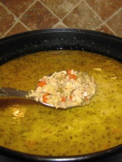 Large pot of Southwest Chicken Soup with a spoonful over the pot.