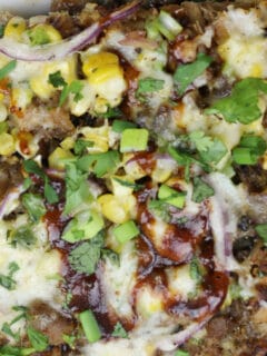 BBQ Pork Pizza with Roasted Corn, Jalapeno, and Smoked Mozzarella is super easy using pre-cooked bbq pork. This BBQ Pork Pizza pops with flavor and is a great addition to a weekly meal plan.