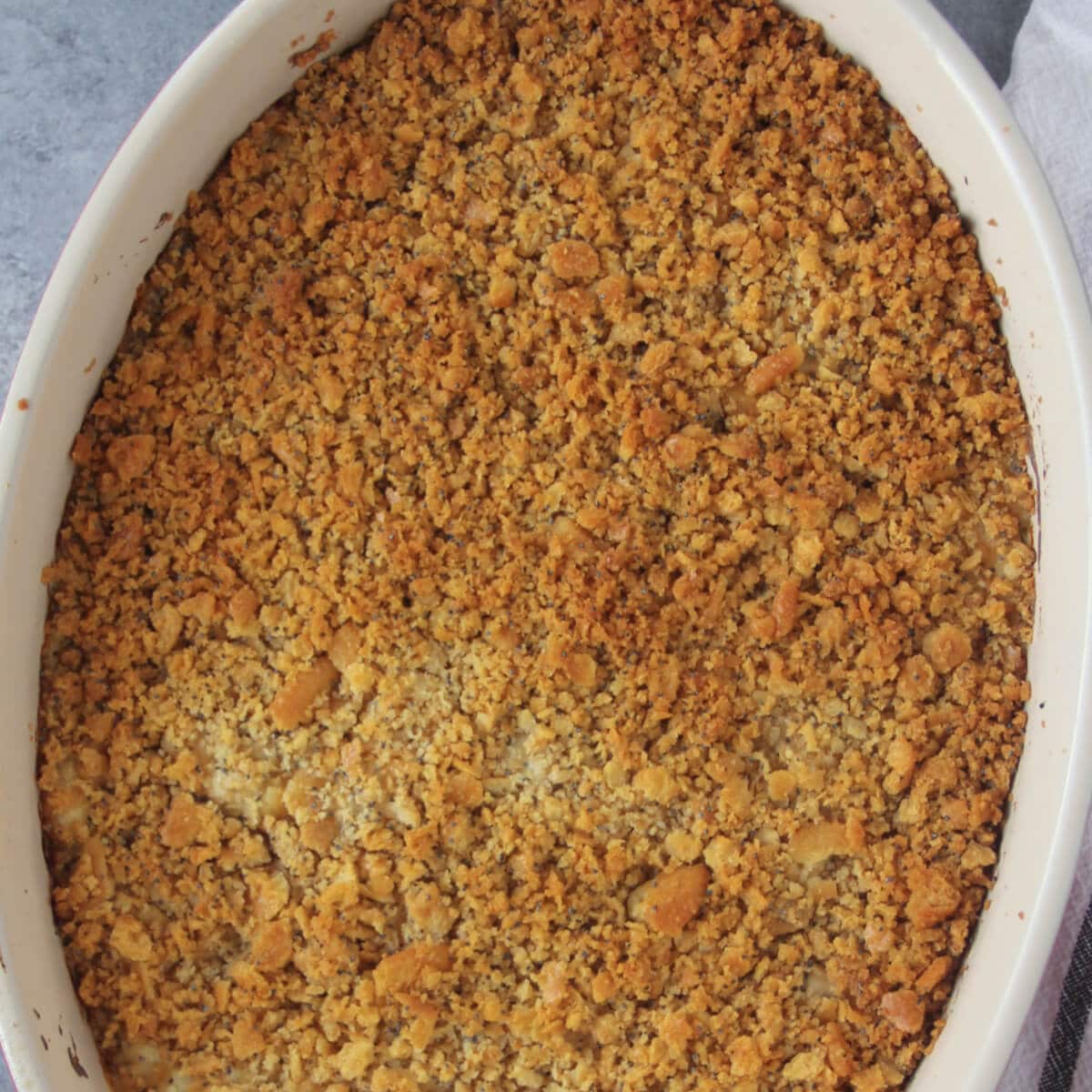 Poppy Seed Chicken Casserole is a Southern favorite and this version has a few secret ingredients that make it the best! It's perfect for a potluck gathering or new parents and it's freezer friendly!