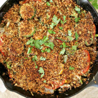 Summer vegetables roasted in a cast iron skillet with toasted breadcrumbs.