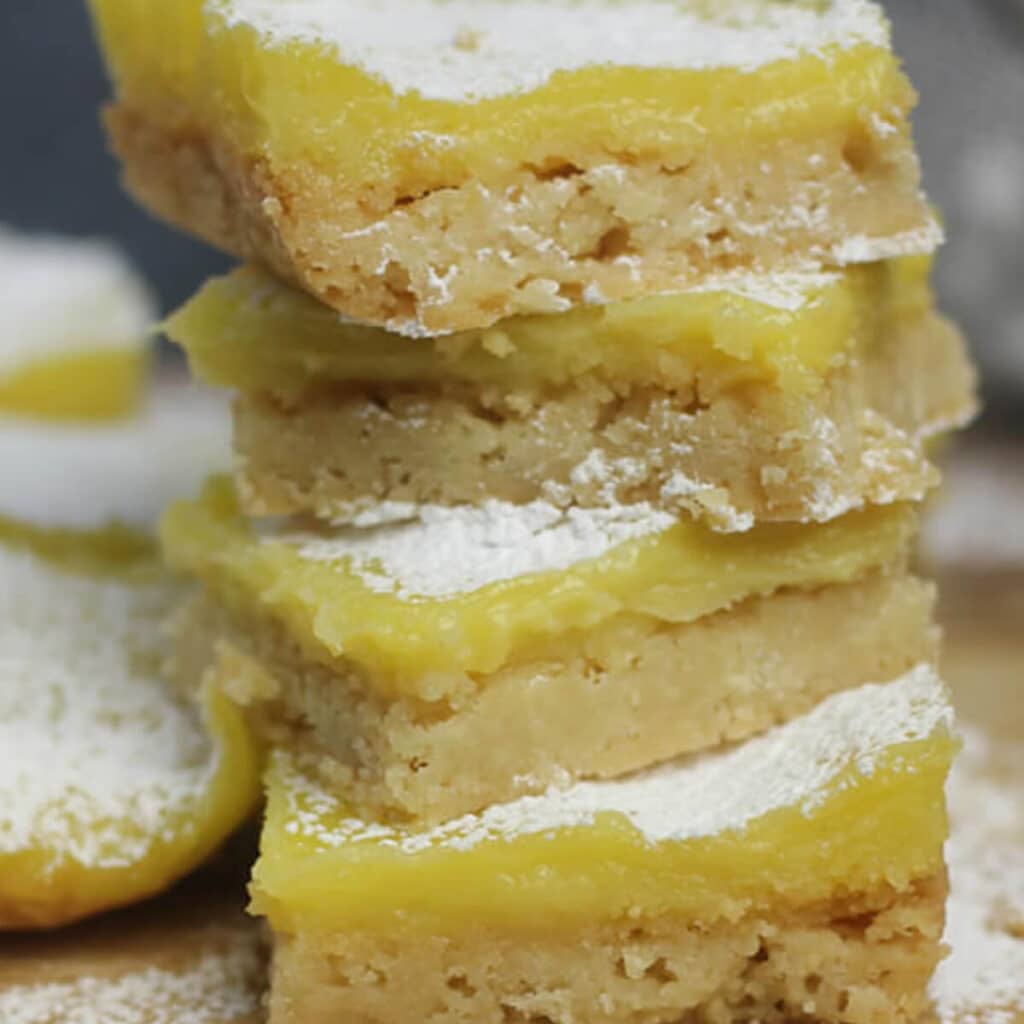 Easy lemon bars with a zesty lemon custard over a crisp brown sugar shortbread crust—these lemon bars are lovely and delicious!