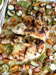 Pesto Chicken with Roasted Vegetables is a low-carb, nutritious, one pan dinner that everyone loves. You can use homemade or store-bought pesto and almost any mixture of vegetables.