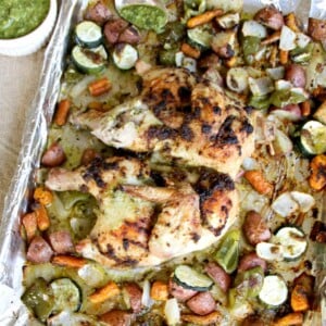 Pesto Chicken with Roasted Vegetables is a low-carb, nutritious, one pan dinner that everyone loves. You can use homemade or store-bought pesto and almost any mixture of vegetables.