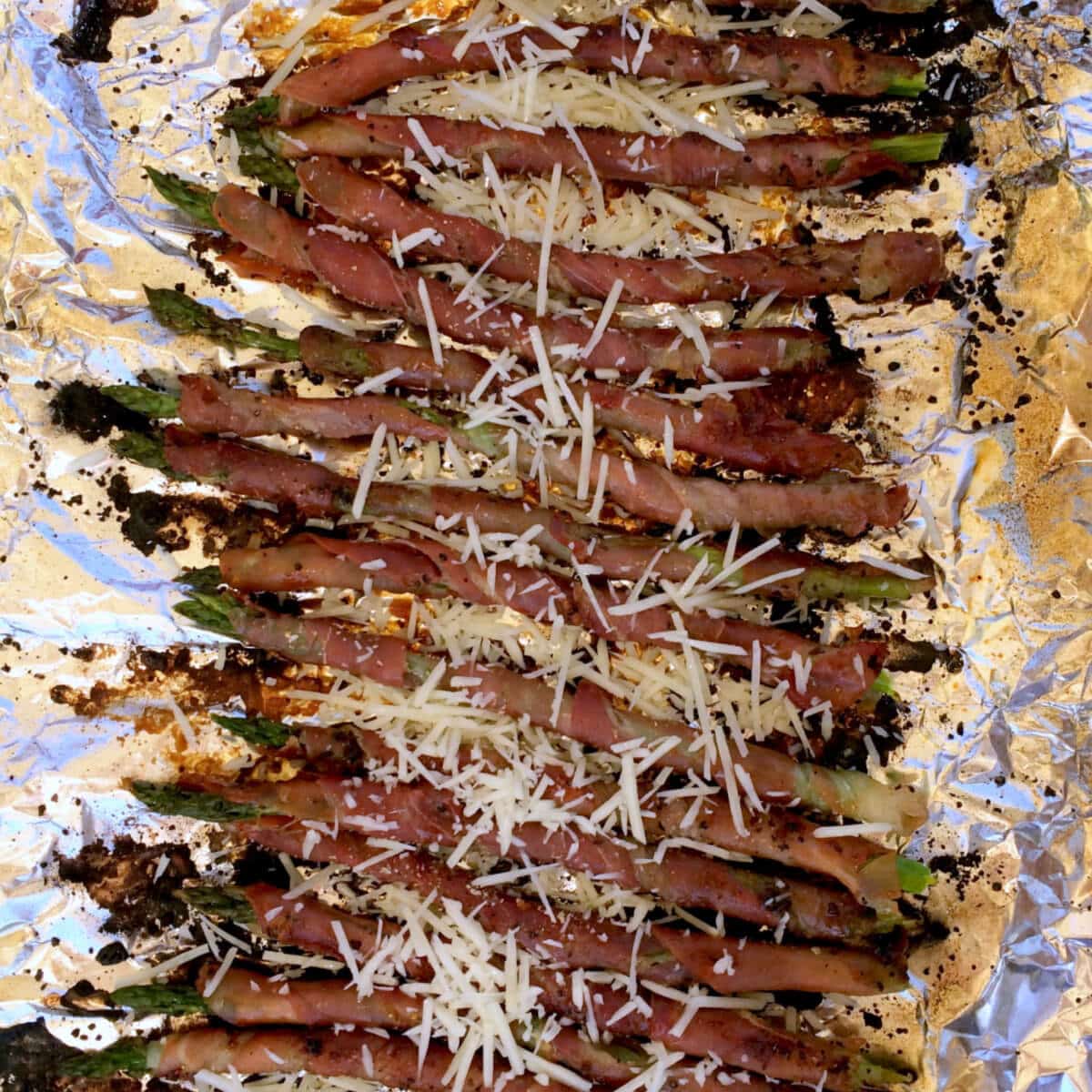 Crispy prosciutto wrapped around asparagus grilled to perfection and topped with grated Parmesan
