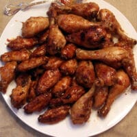 Honey Baked Chicken Wings on a white plate.