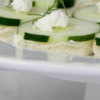 Cucumber sandwiches on a platter ready to serve.