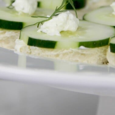 Cucumber sandwiches on a platter ready to serve.