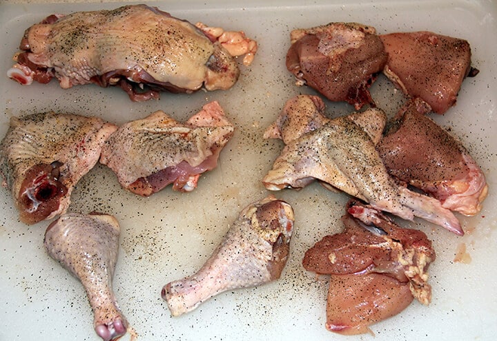 Cut up pieces of chicken ready to fry.