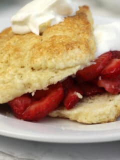 Strawberry shortcake recipe with easy, homemade biscuits using cream and brown sugar.