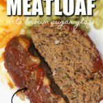 Two slices of meatloaf on a white plate.