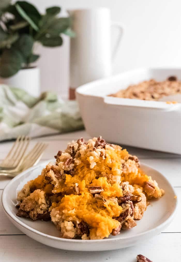 Single serving of Southern sweet potato casserole on a white plate.