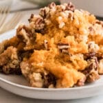 Southern Sweet Potato Casserole features a traditional pecan and brown sugar streusel topping rather than melted marshmallows.