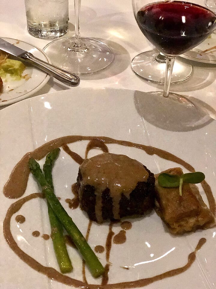 A plate featuring a filet and asparagus at the Grand Fiesta Americana Coral Beach.