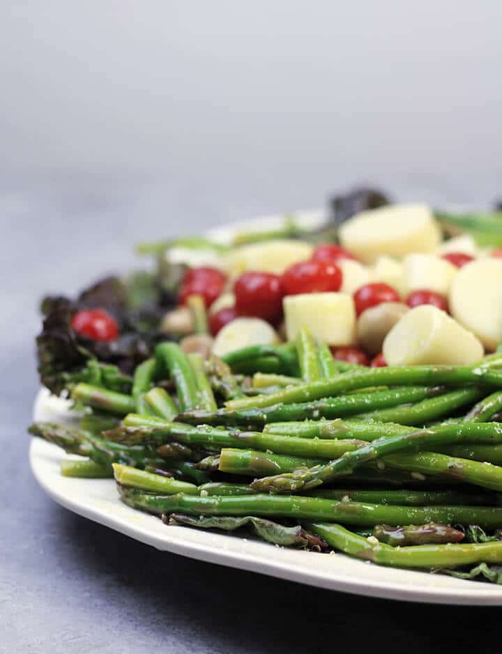 A plate of Asparagus and other Marinated Vegetables.