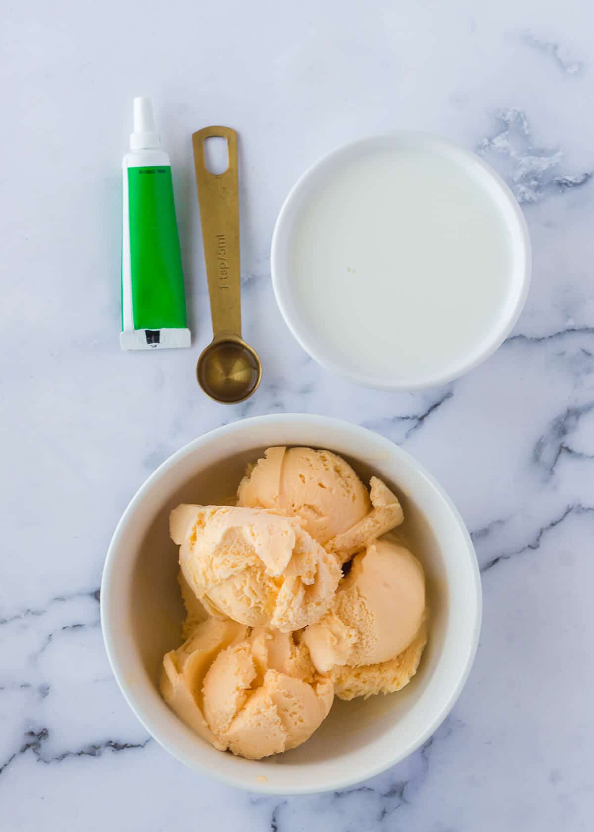 Overhead photo of a bowl of vanilla ice cream.