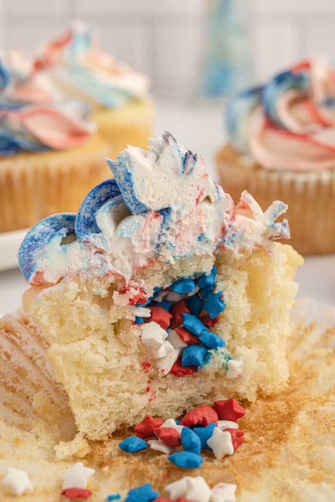 Inside view of a 4th of July cupcake filled with red, white, and blue star sprinkles.