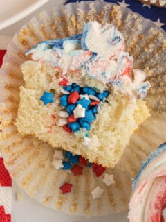 Closeup view of the inside of a 4th of July cupcake pinata with sprinkles.