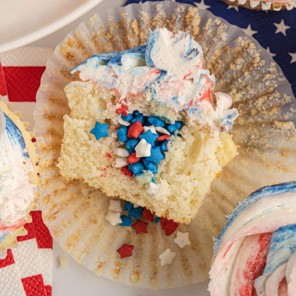 Closeup view of the inside of a 4th of July cupcake pinata with sprinkles.
