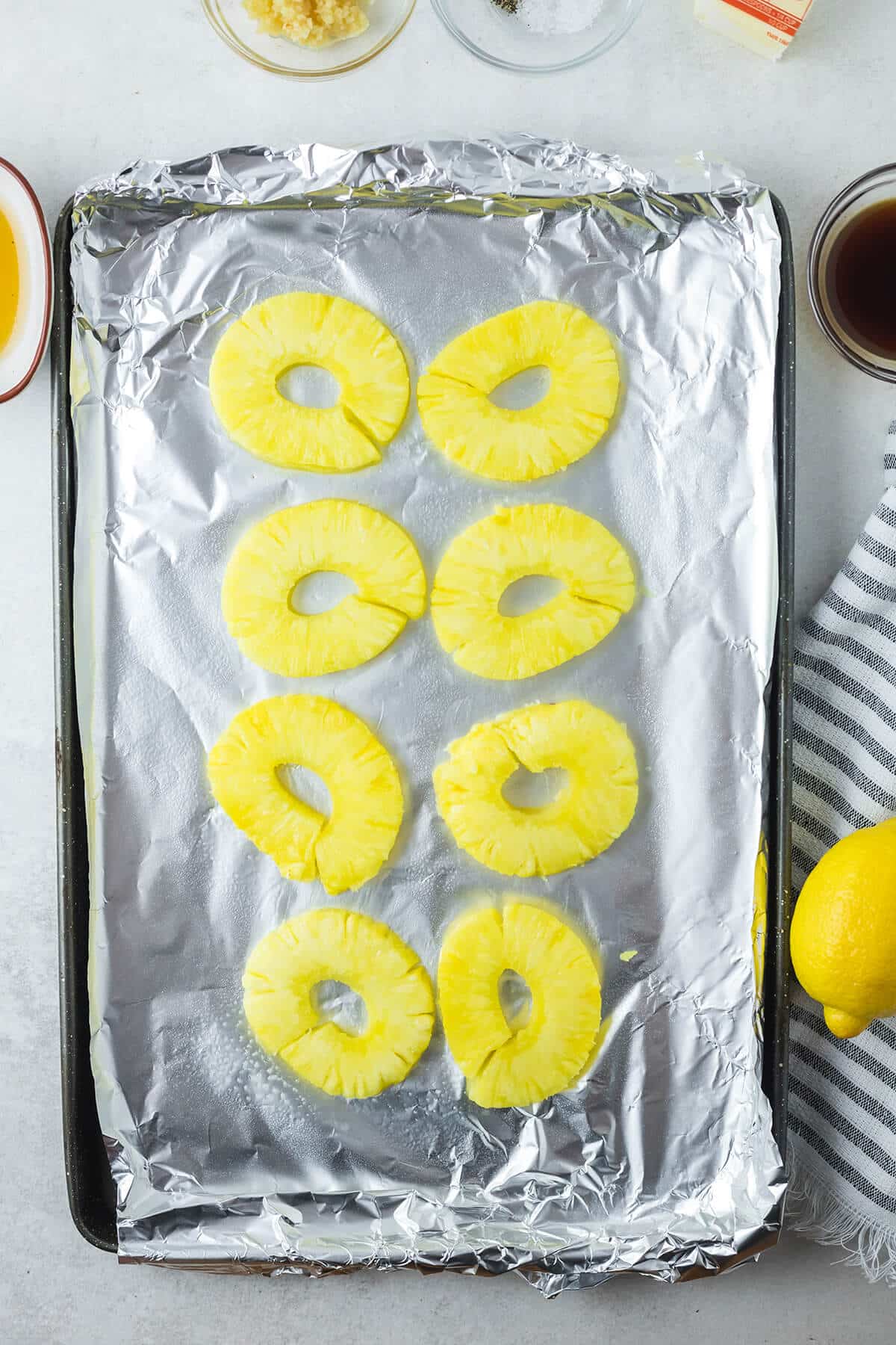pineapple rings on the baking sheet.
