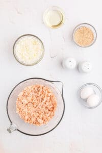 bowls of chopped onion canned salmon and bread crumbs