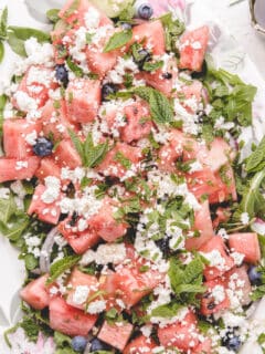 close up of salad with fresh diced watermelon and feta cheese crumbles