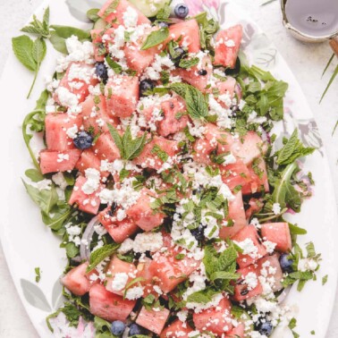 close up of salad with fresh diced watermelon and feta cheese crumbles