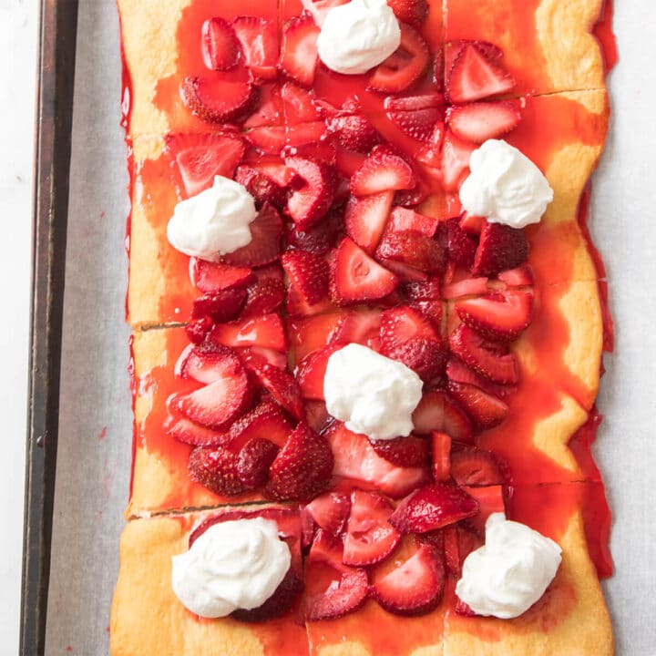 strawberries and whipped cream on crust