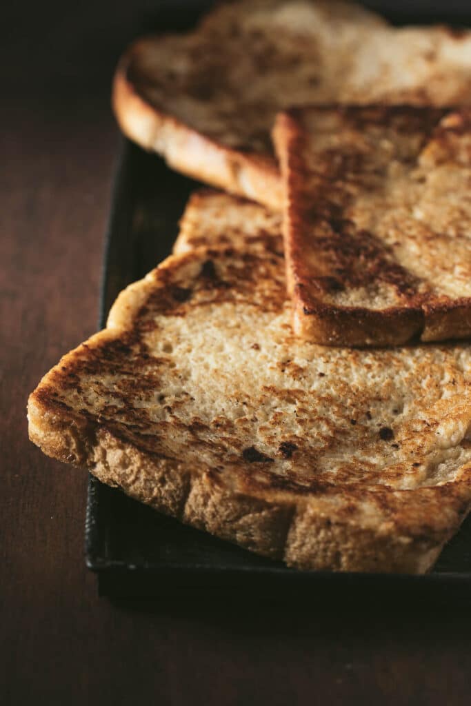 French toast on a baking sheet to stay warm.