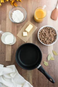Gravy ingredients laid out on a wooden cutting board.