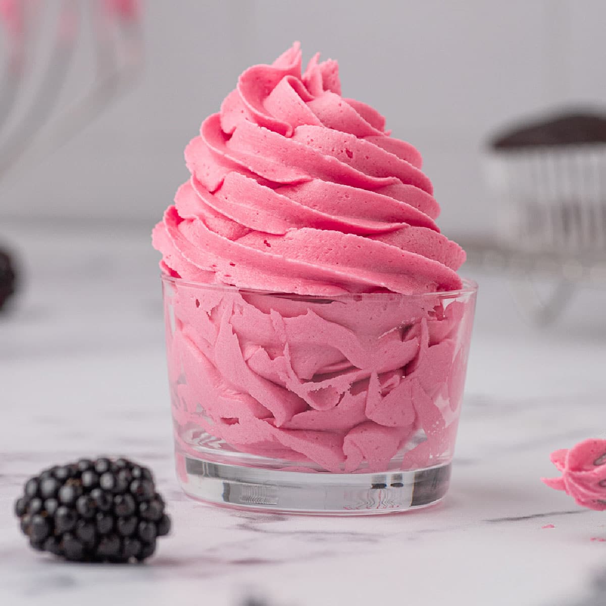 Gorgeous blackberry buttercream frosting with fresh blackberries makes any dessert 