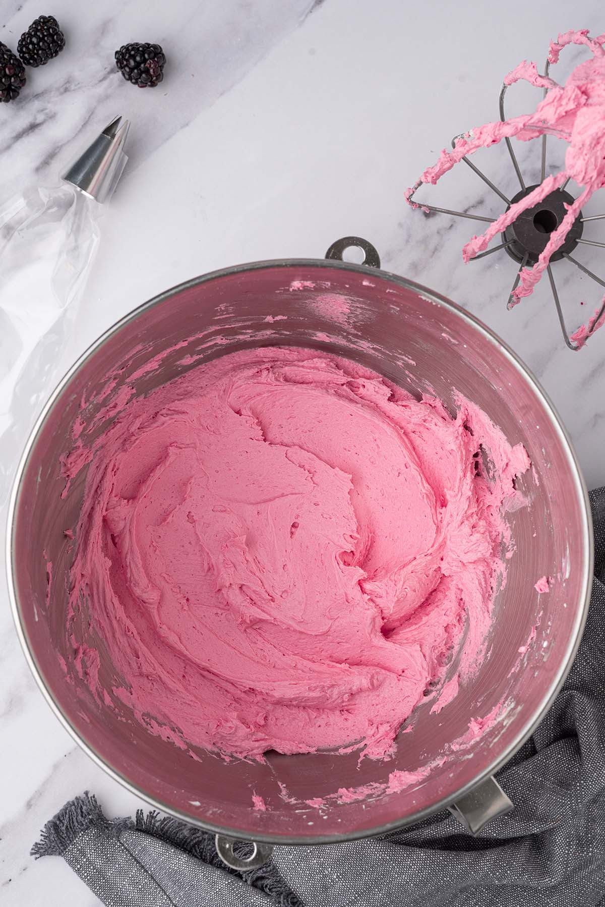 A bowl of pink frosting.