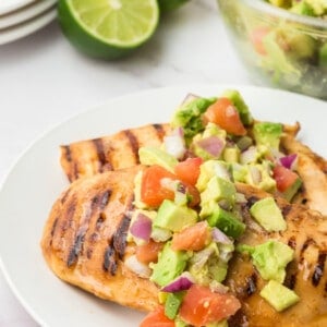 Grilled chicken topped with avocado salsa.