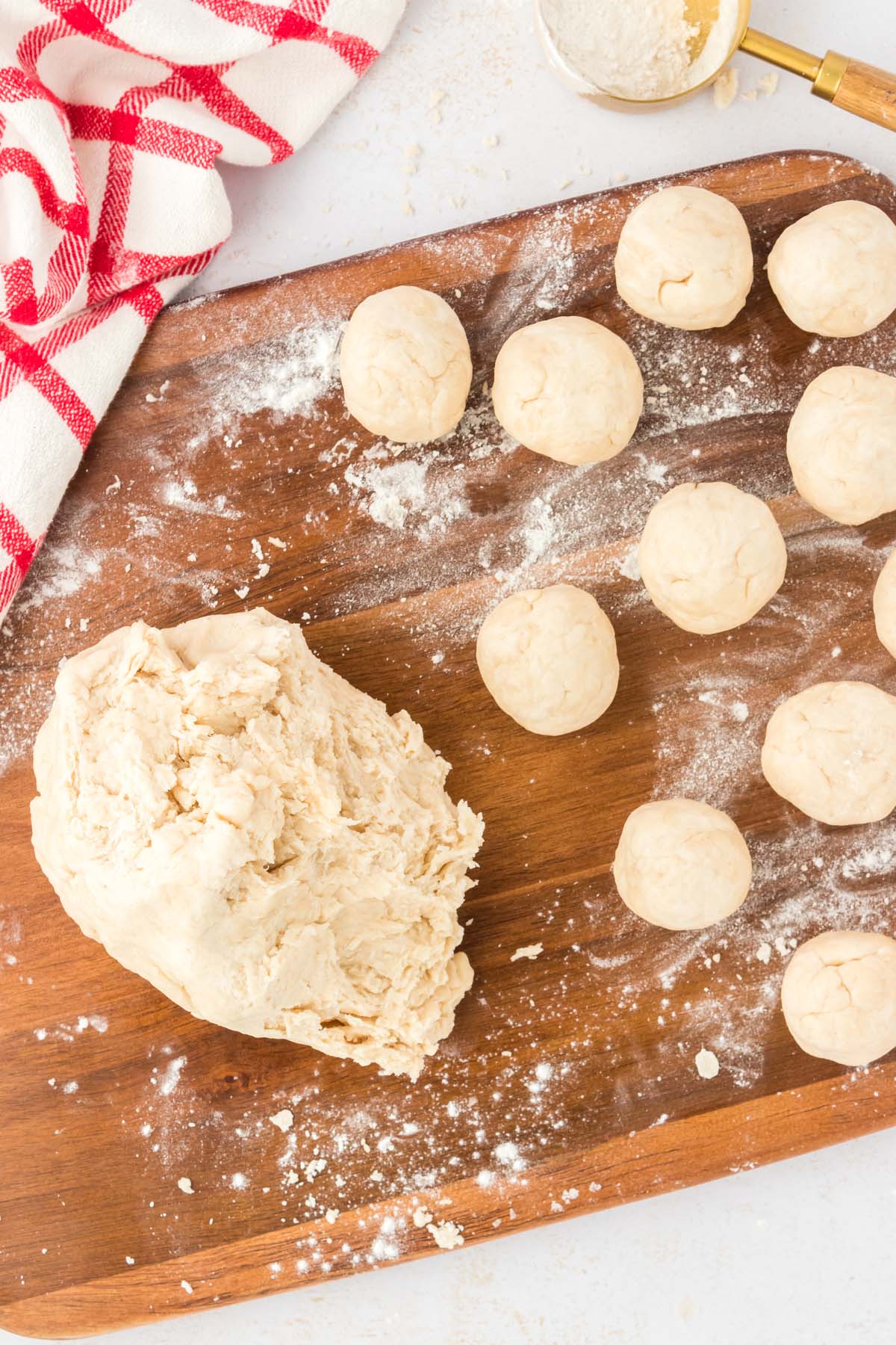 Balls of dough on a board.