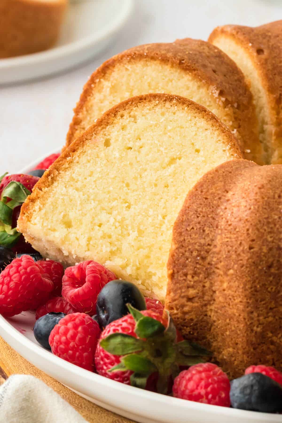 Slice of cream cheese pound cake with berries.