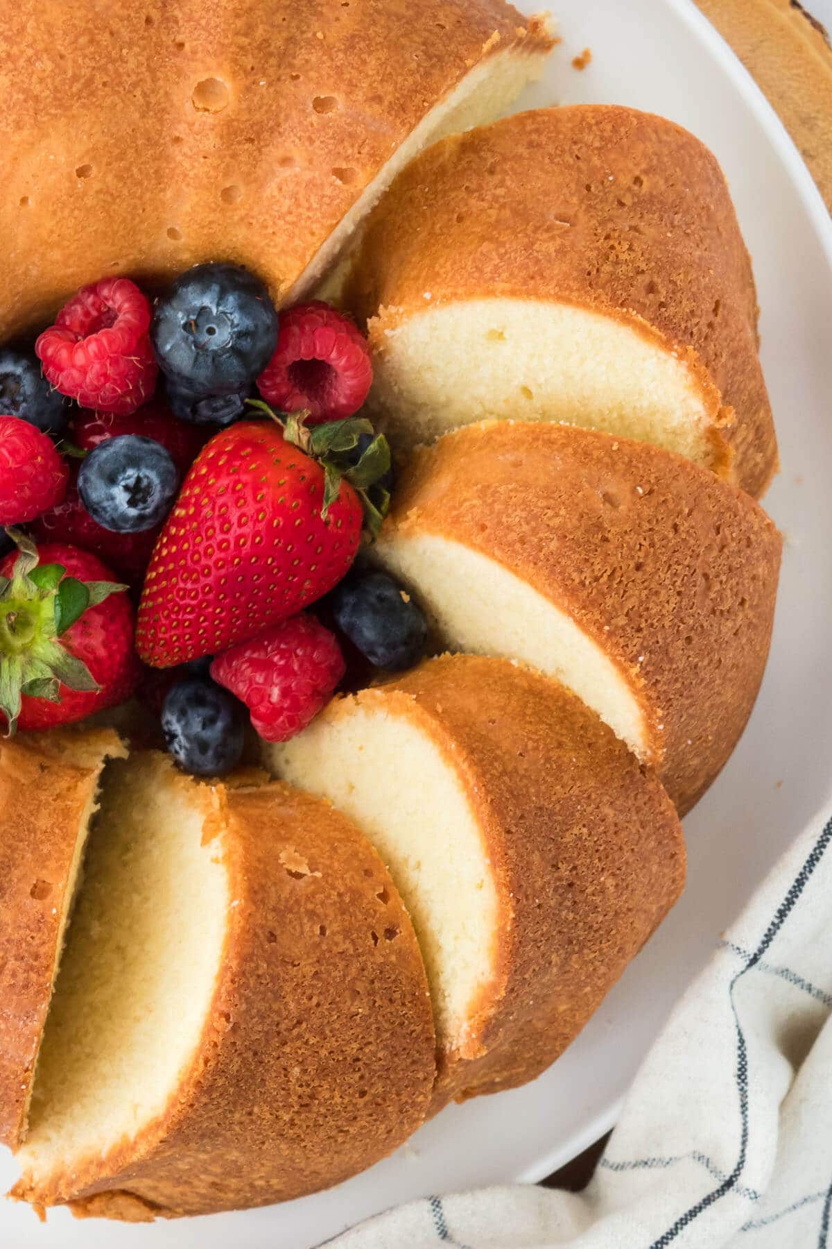 overhead photo of a cake on a white plate.