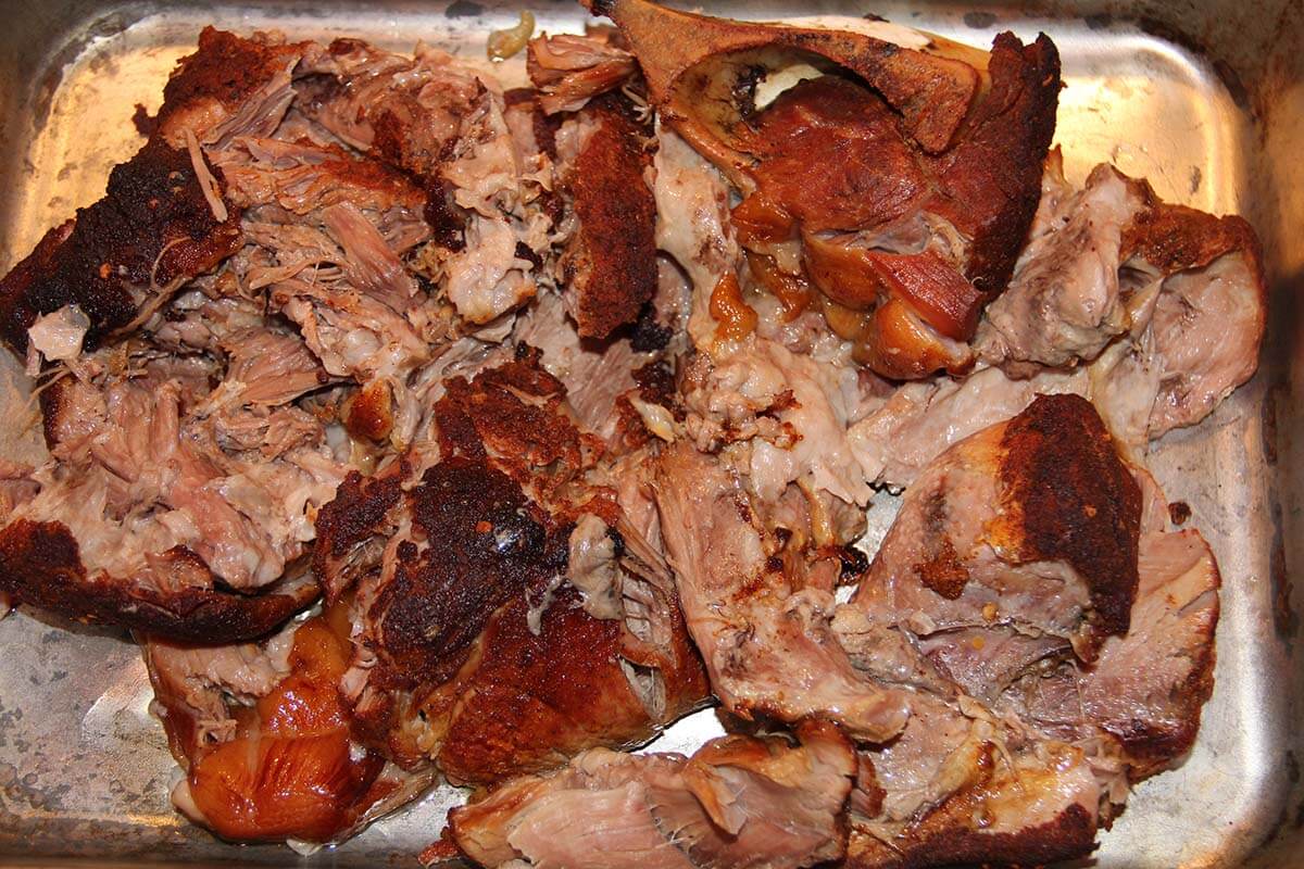 A pan of roasted oven pulled pork.