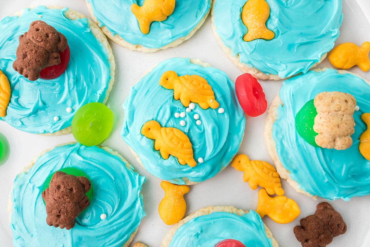 blue frosted beach cookies with fish toppings.